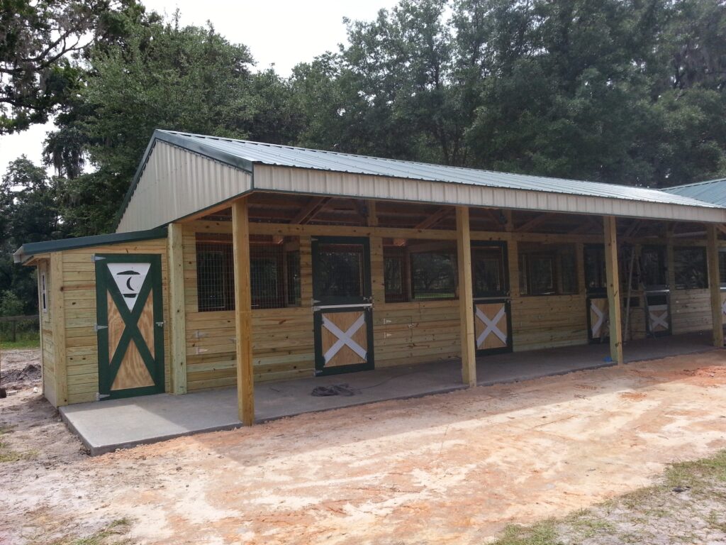 Center-Aisle Barn with 12x12 Stalls built by Buildings By Bill in Florida