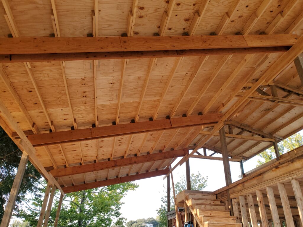 Open-sided pole barn with exposed rafters built by Buildings By Bill in Florida